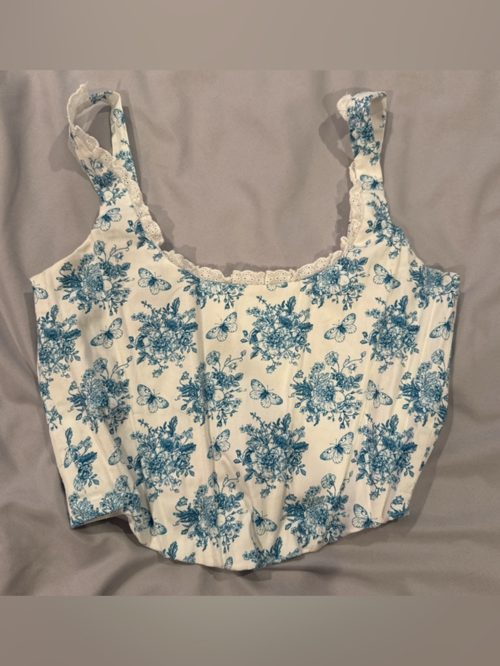 With Jean blue and white butterfly floral corset top. Size XS.